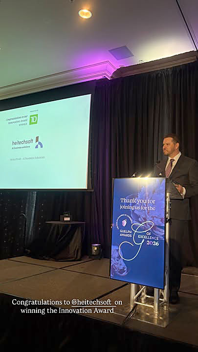 HeitechSoft representative standing at the podium during the Guelph Awards of Excellence Innovation Award presentation